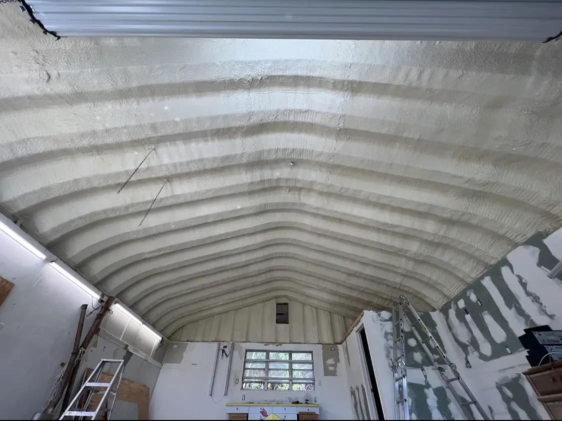 Spray polyurethane foam applied to the underside of a metal roof deck in Ottawa